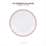Dinner plate with red floral pattern on a white background